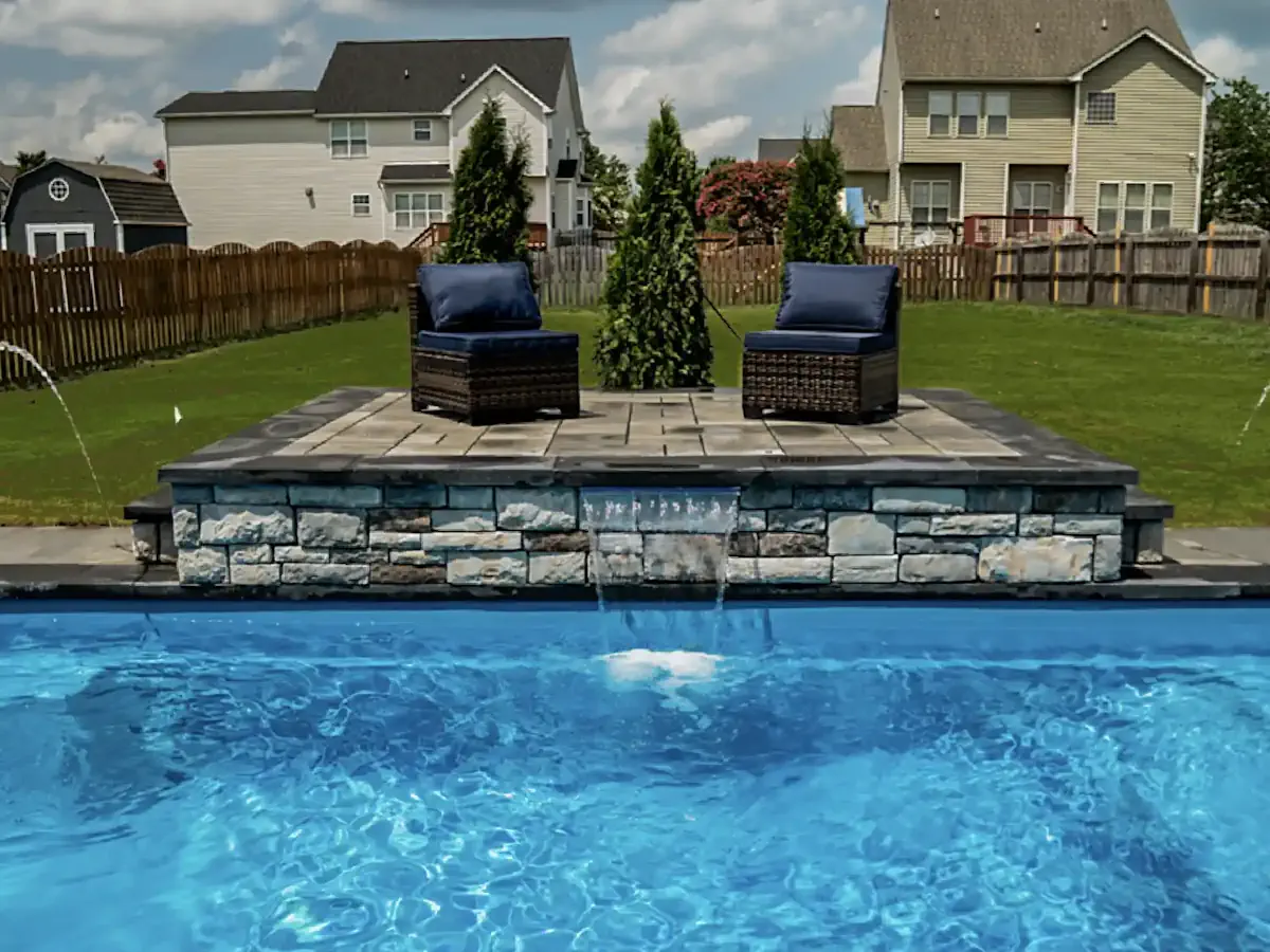 An El Capitan fiberglass inground pool in Glacier Blue color